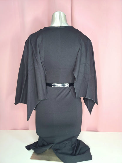 Back of dress on a mannequin against a pink background 