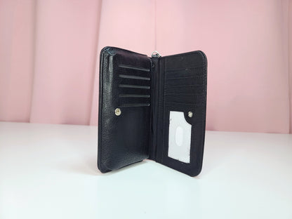 Inside of wallet against a pink background