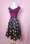 Top shown with Fit & Flare Moon & Butterfly Print Skirt on a mannequin against a pink background