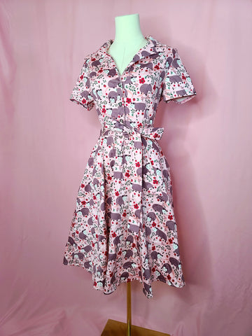 Front of dress shown on a white mannequin against a pink background