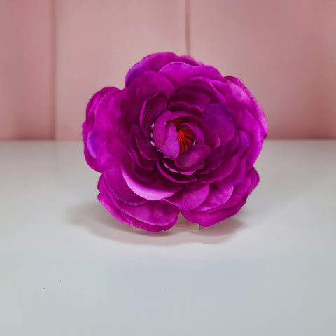 Hair flower against a white and pink background