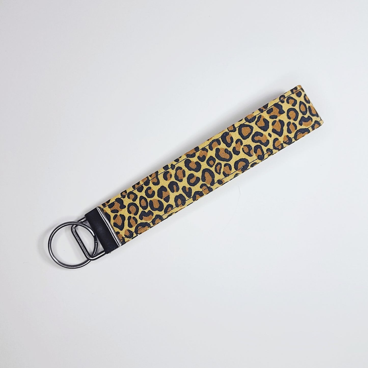 Leopard print key loop against a white background