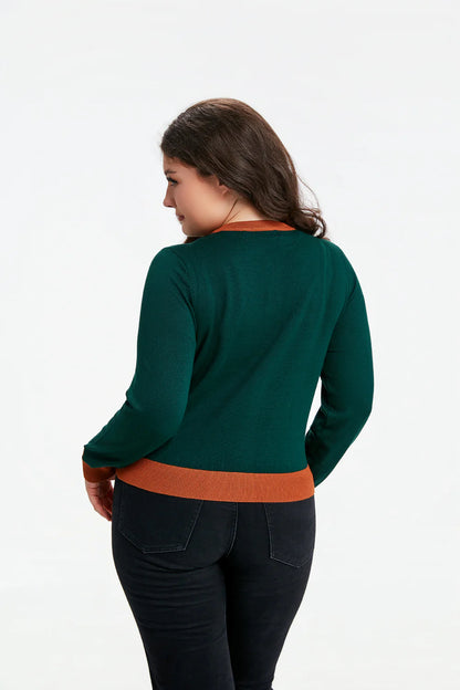 Female model wearing the Leslie Mushroom cardigan facing away to show the back of the cardigan against a white background.