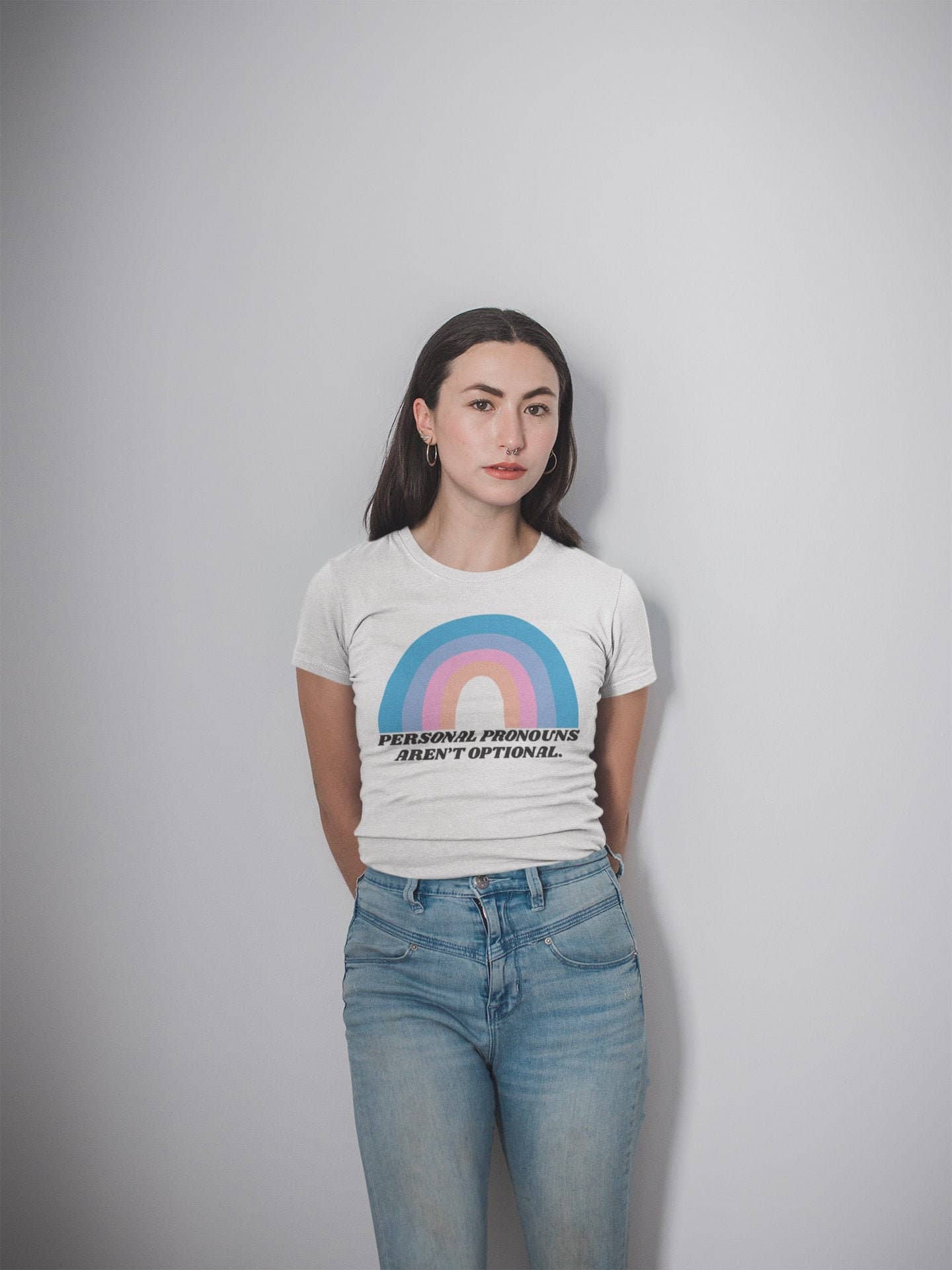 Model wearing tee against darkened background