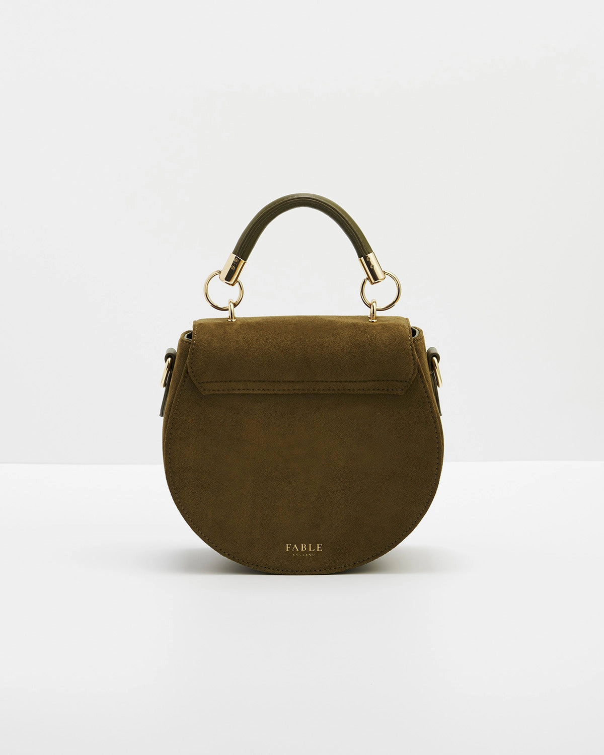 Back of saddle bag with short handle against a white background.