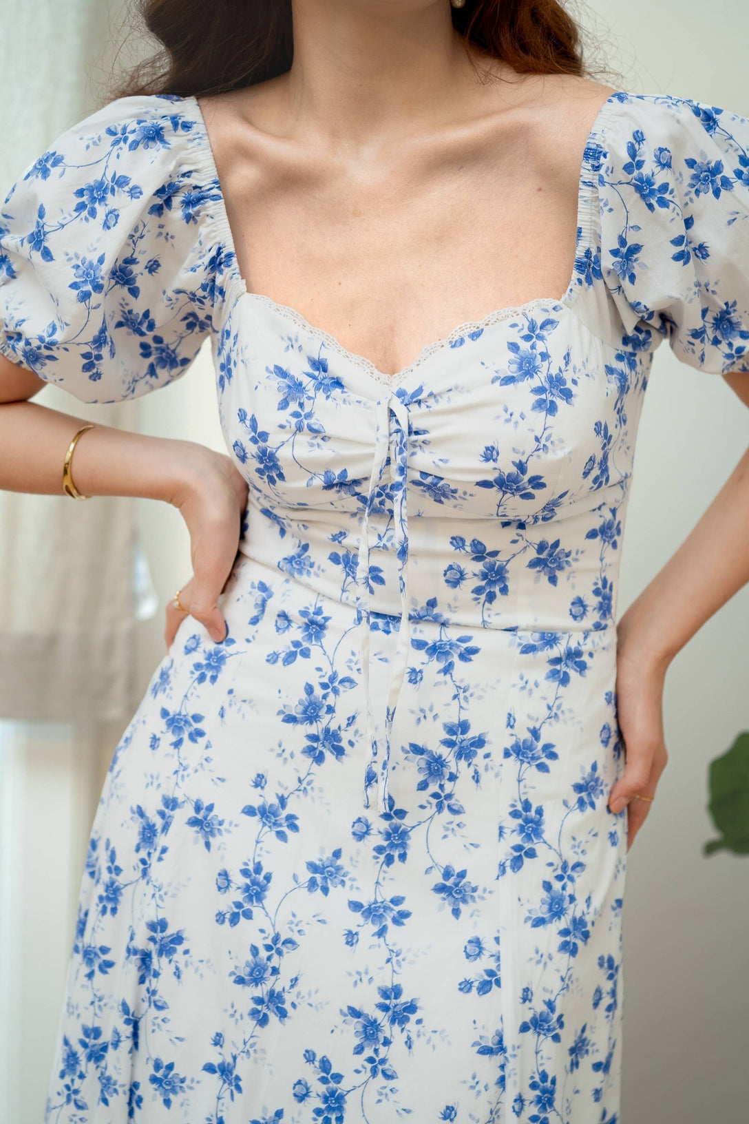 Close up of the front of the dress to show ruffle edges, and the fabric tie on the front