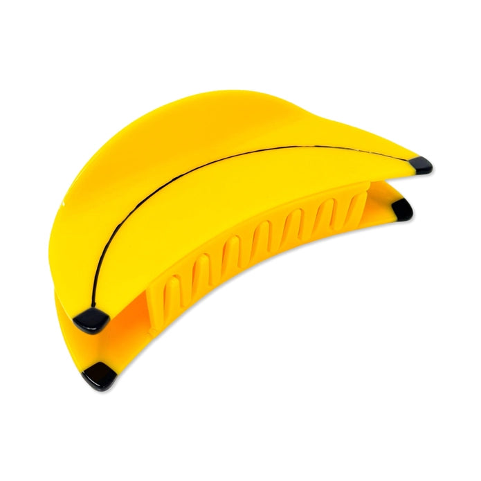 Banana hair claw on the side showing hair claw teeth against a white background.