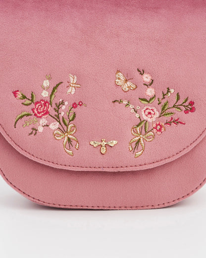 Close up of the pink floral bouquets on both sides of the front flap against a white background.