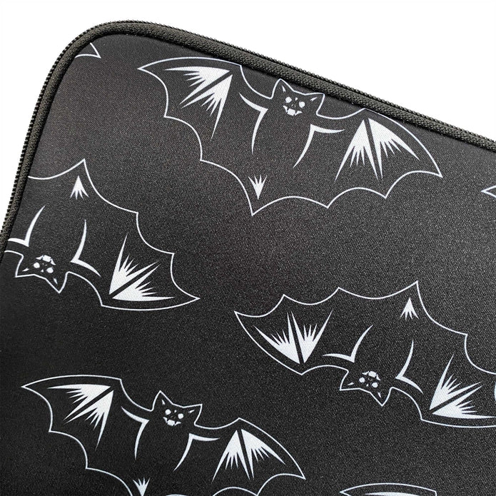 Close up of the bats on the front of the laptop sleeve. Design feature smiling bats alternating up and down on a black background -shown against a white background