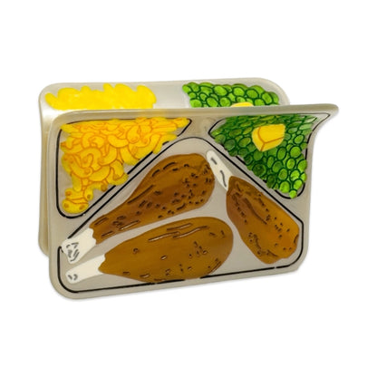 Front of the TV dinner hair claw against a white background.