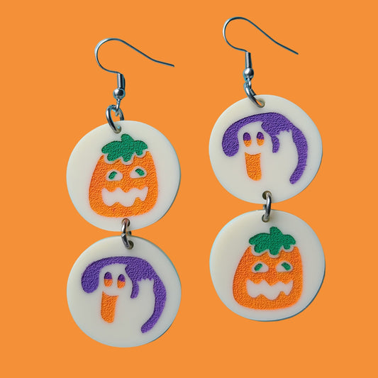 Earrings against orange background