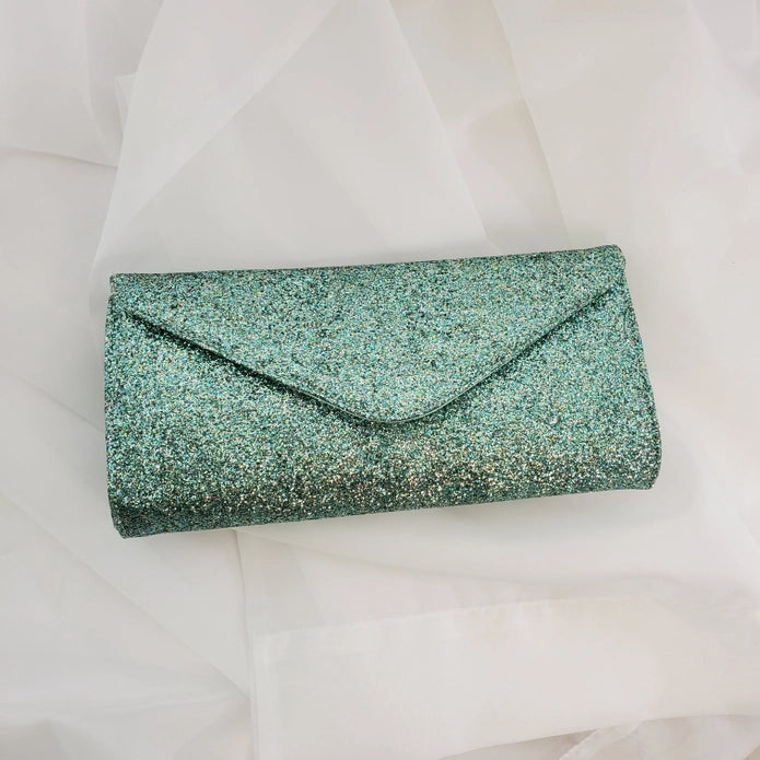 Front of clutch shown against a white tulle background