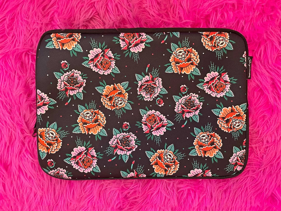 Front of laptop sleeve against a hot pink shag carpet background