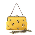 Front of purse with chain laying in front