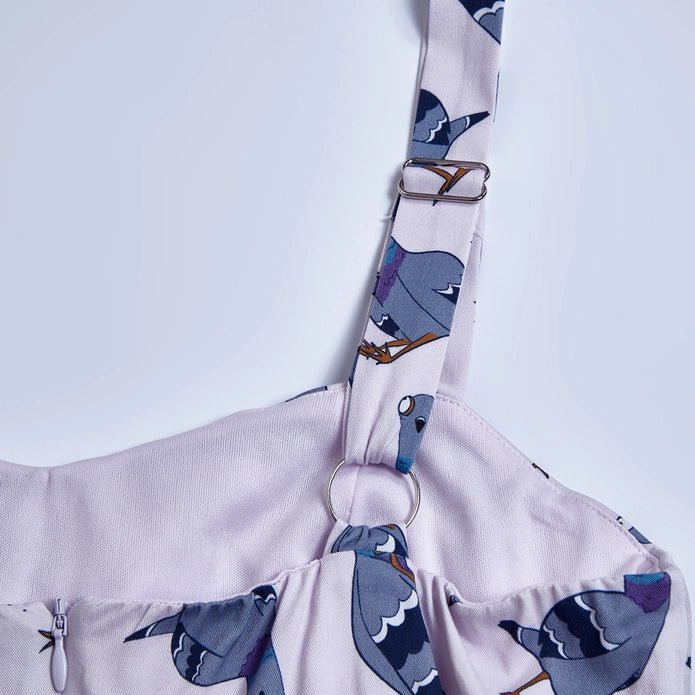 Close-up of adjustable strap against a white background.