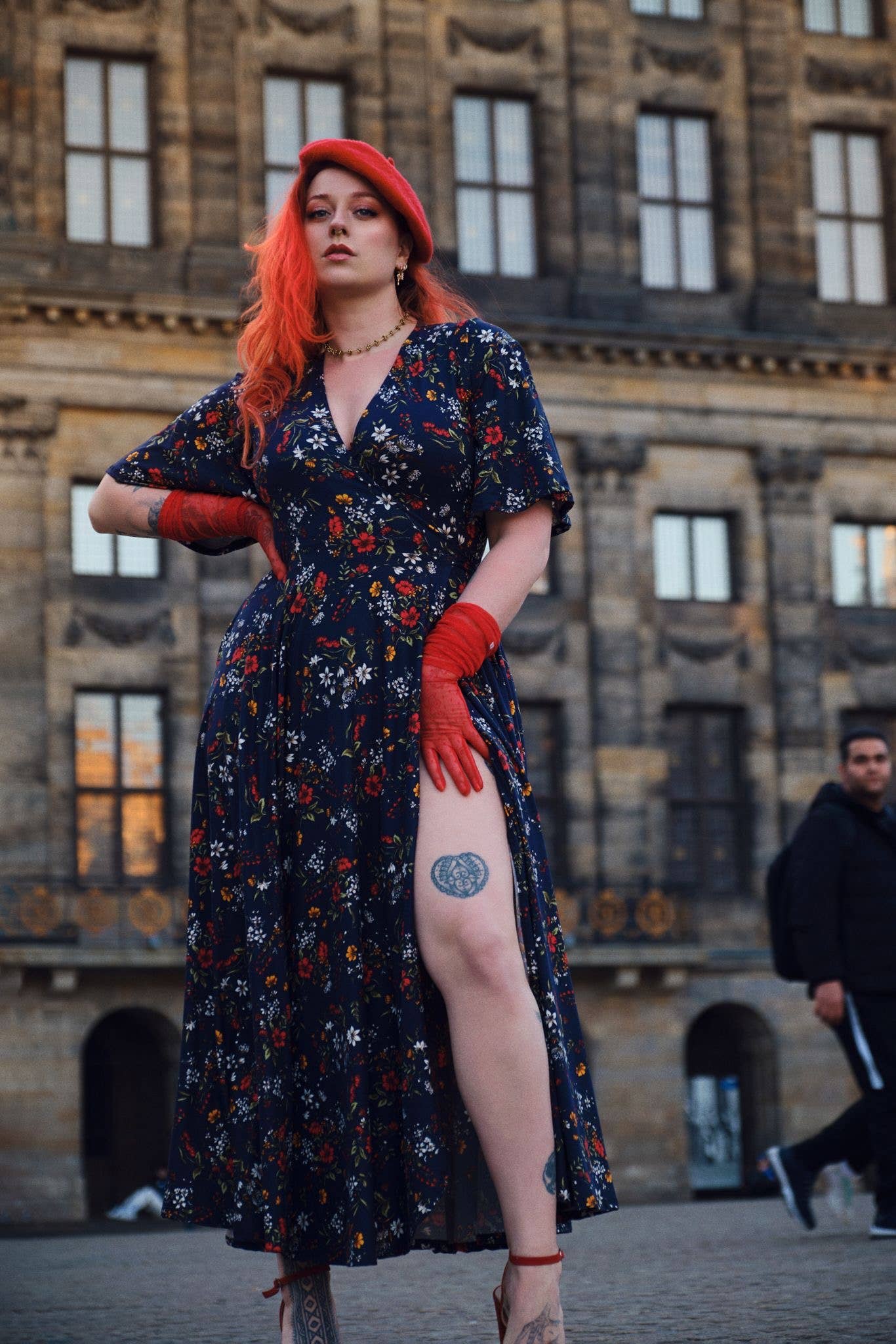 Redheaded model front facing with hand on thigh