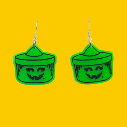 Earrings against yellow background