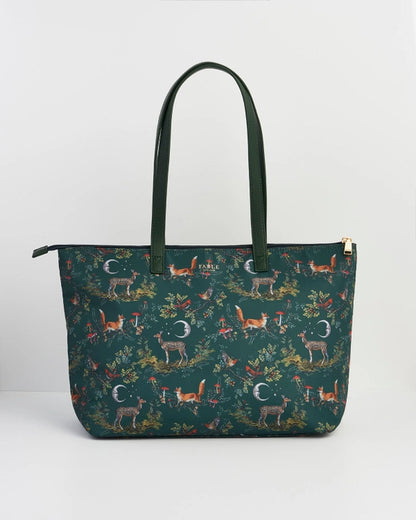 Front of tote bag with green handle against a white background.
