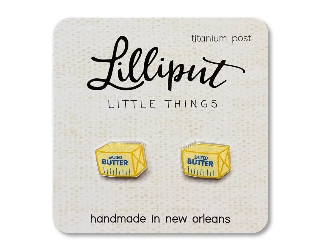Stick of butter earrings on a Lilliput backing card against a white background.