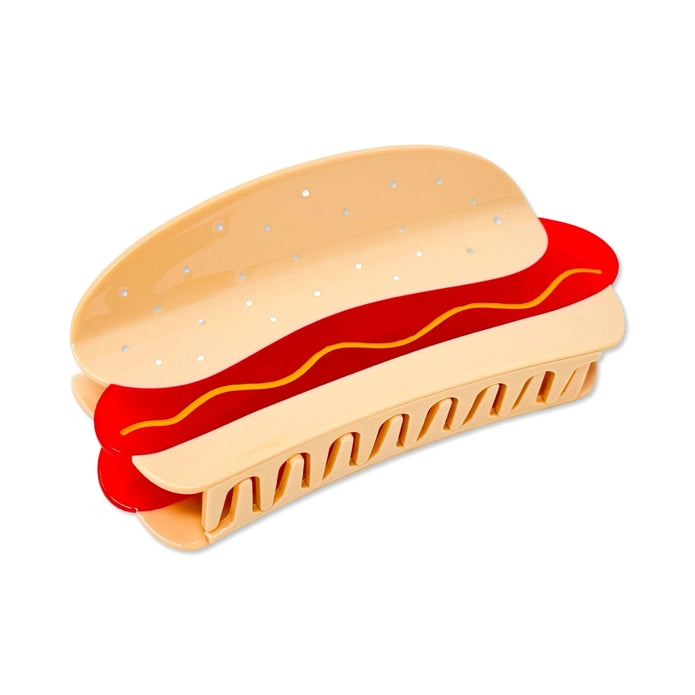 Hot dog hair claw on it's side showcasing the teeth against a white background.