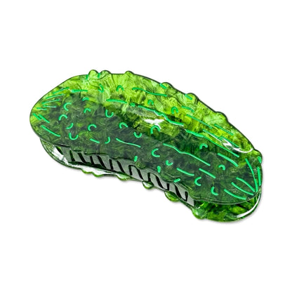 Green pickle hair claw against a white background.