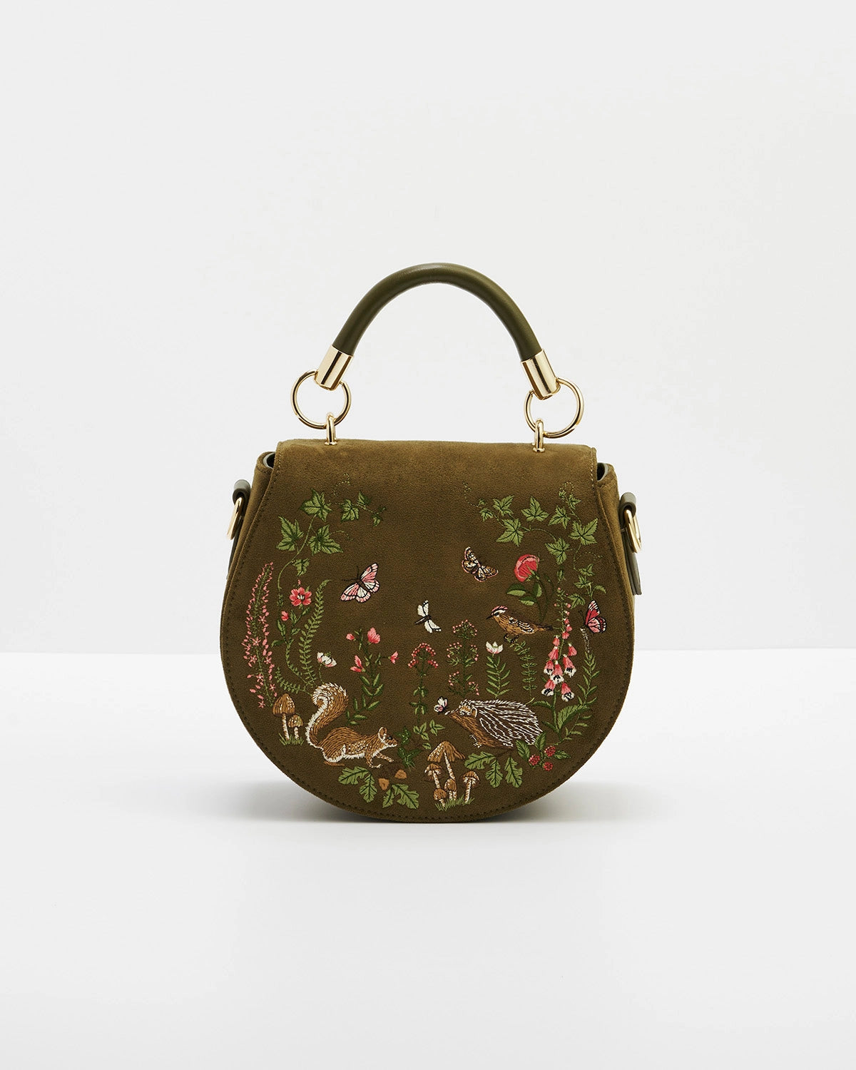 Front of saddle bag shown with short handle against a white background.