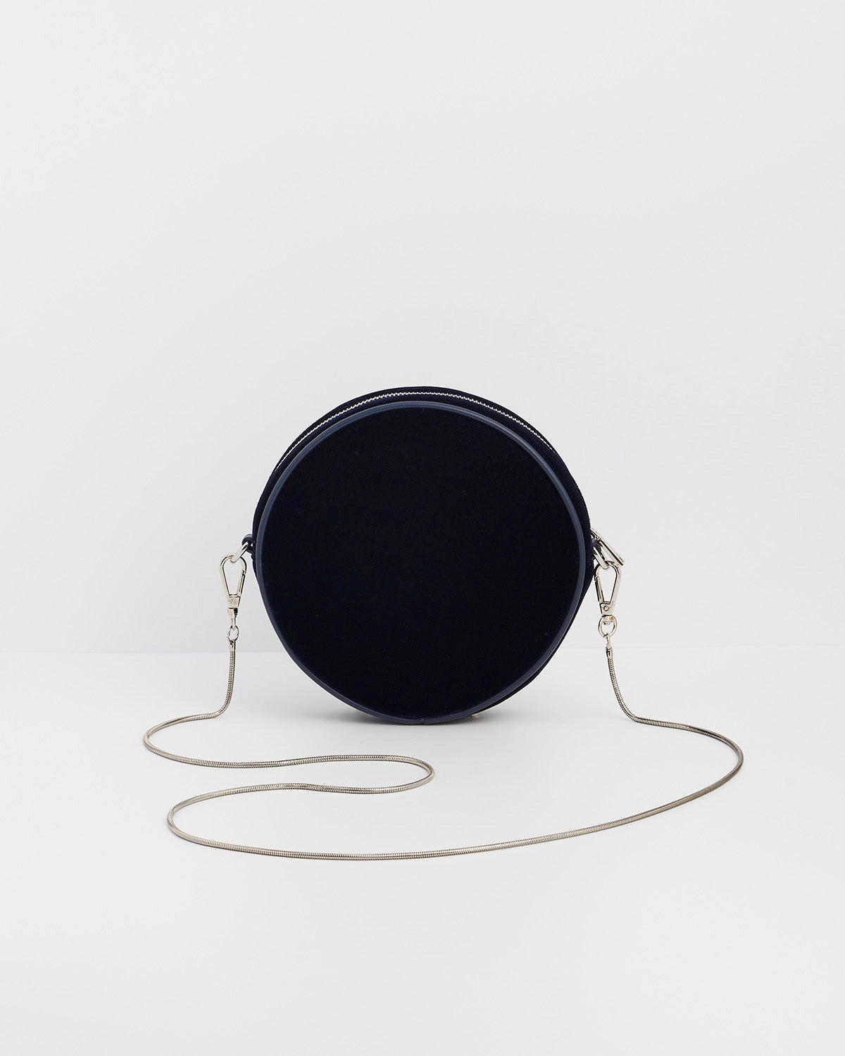 Back of purse with chain against a white background.