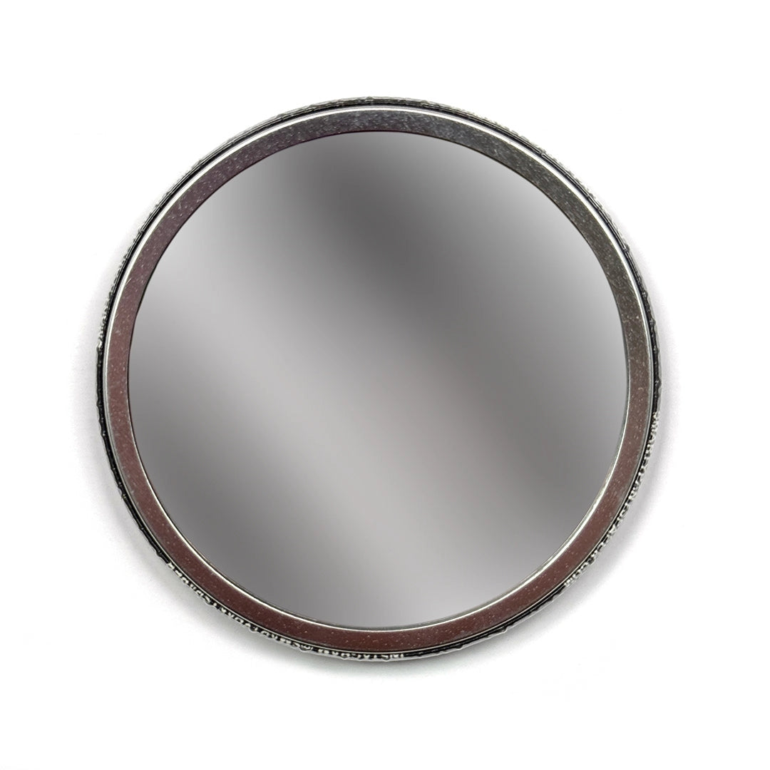 Circle mirror against a white background.