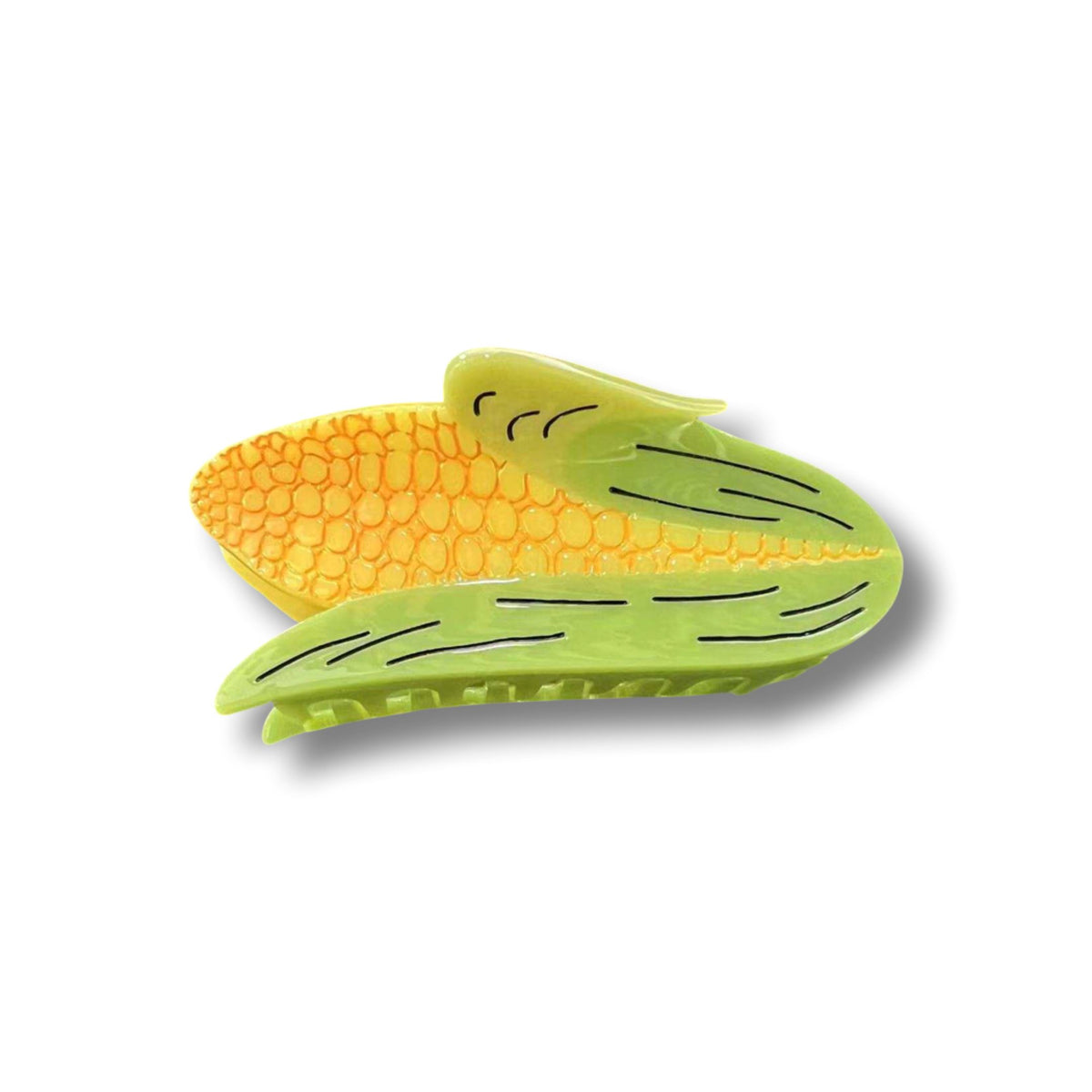 Corn hair claw laying sideways against a white background.
