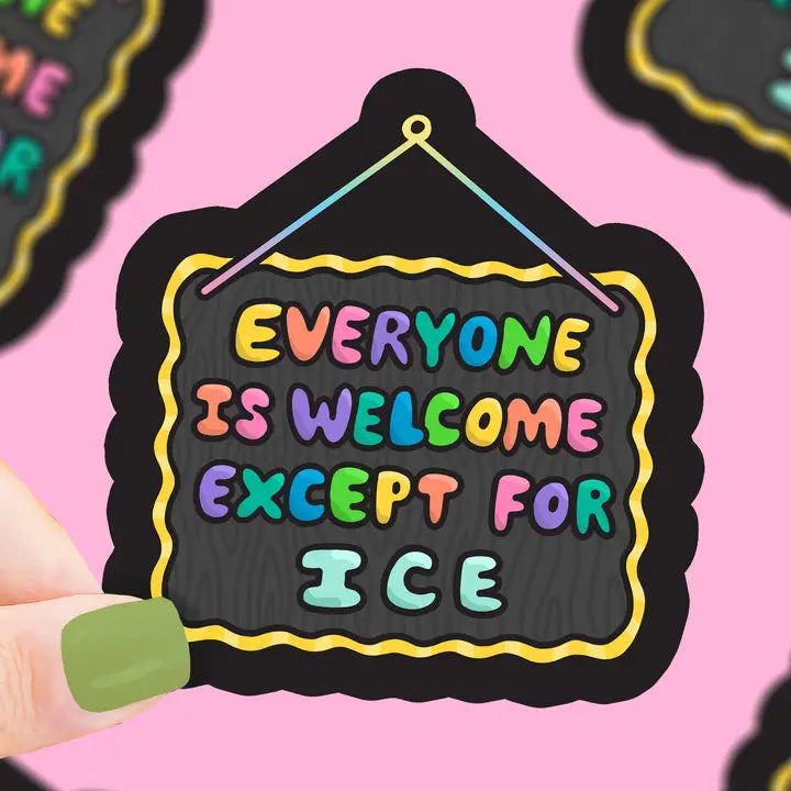 Hanging sign design with rainbow lettering with a black border against a pink background.