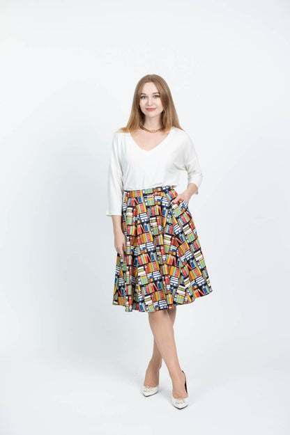 Model showing front of the skirt with one hand in pocket against a white background