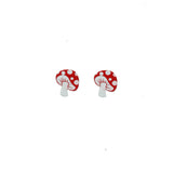 This photo shows an upclose look at the earrings. Earrings are white mushrooms with red tops
