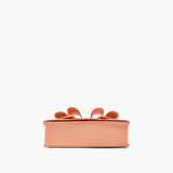 This photo shows the bottom of the purse against a plain white background