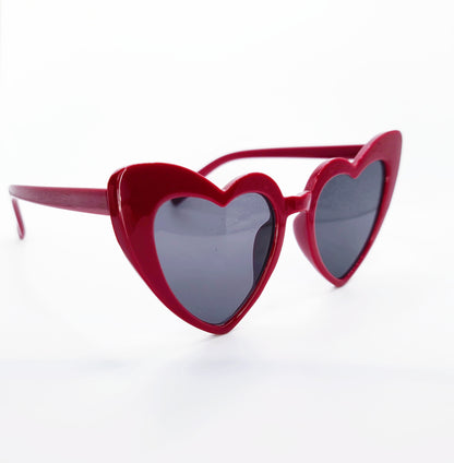 Deep red heart sunglasses. Hearts have the outside half is higher than the inside. Has black lenses