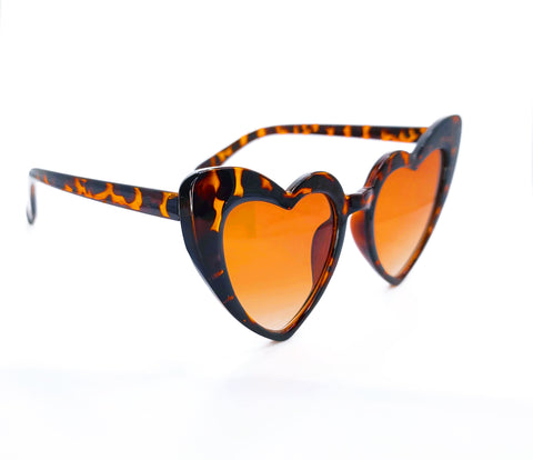 Dark brown and dark yellow spotted color heart shaped sunglasses. Hearts have the outer edge higher than the inner heart half. Has dark yellow lenses
