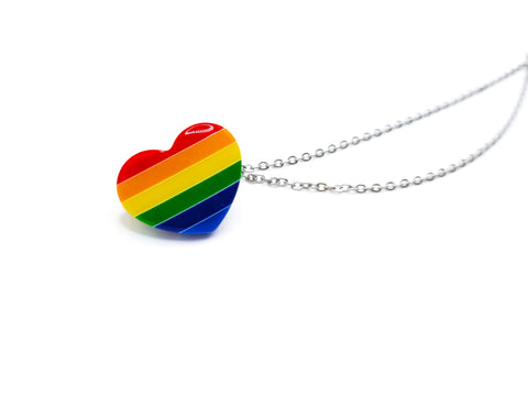 Heart with rainbow lines. Rainbow colors include: red, orange, yellow, green, dark blue, light blue. Heart is attached to 2 silver chains