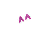 A 1950s boomerang in pink holographic glitter in stud earrings