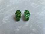 Coffin shaped stud earrings with green glitter color