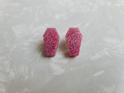 Coffin shaped stud earrings in pink holographic glitter