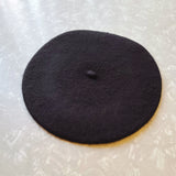 Beret at an angle against a light background