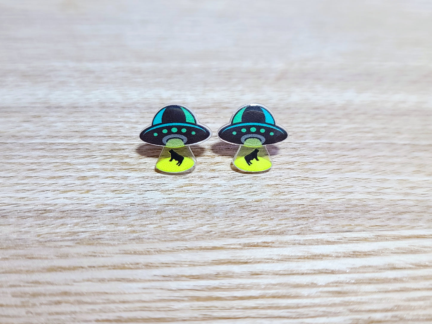 Earrings against a wood background