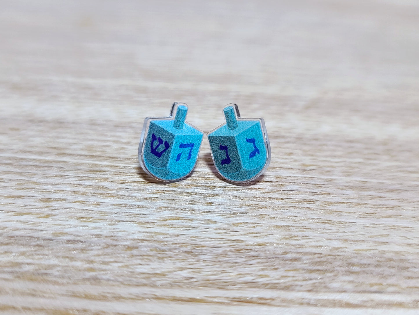 Earrings against a wood background