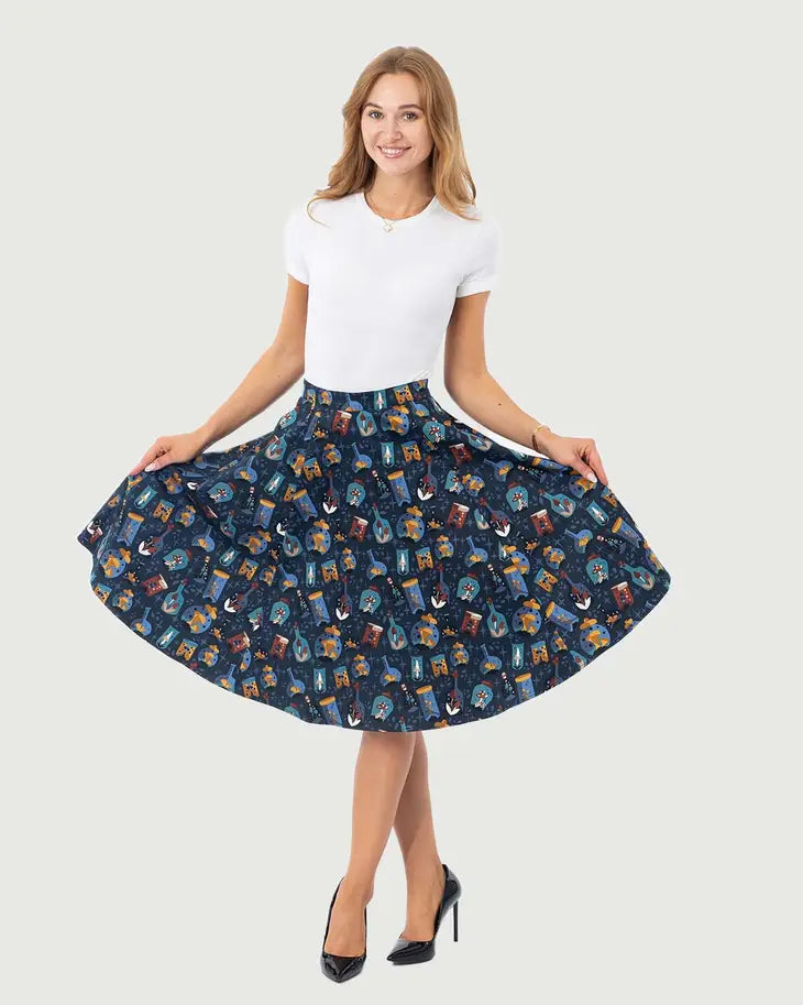 Model holding skirt out at sides