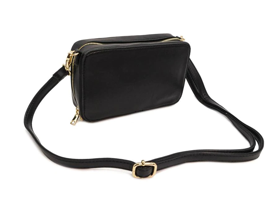 Purse is shown against a white background. Purse is a black cassette tape, and is shown from the back which is a solid black. Purse has a black strap