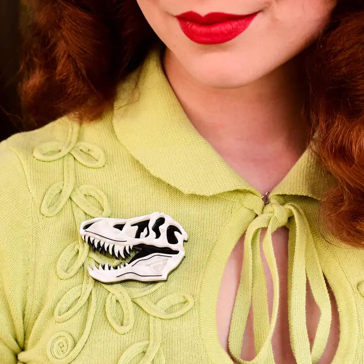 Model wearing brooch on yellow blouse