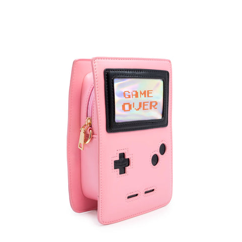 Photo shows the purse from an angle. Purse is a light pink with game-boy like features. Screen says "Game Over"