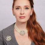 Model wearing earrings and necklace