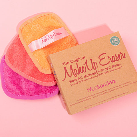 Makeup erasers and box against a pink background