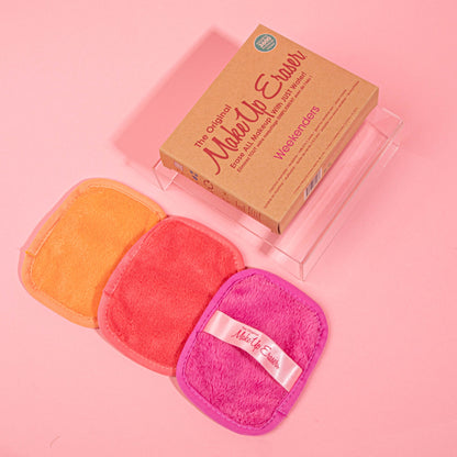 Makeup erasers and box against a pink background