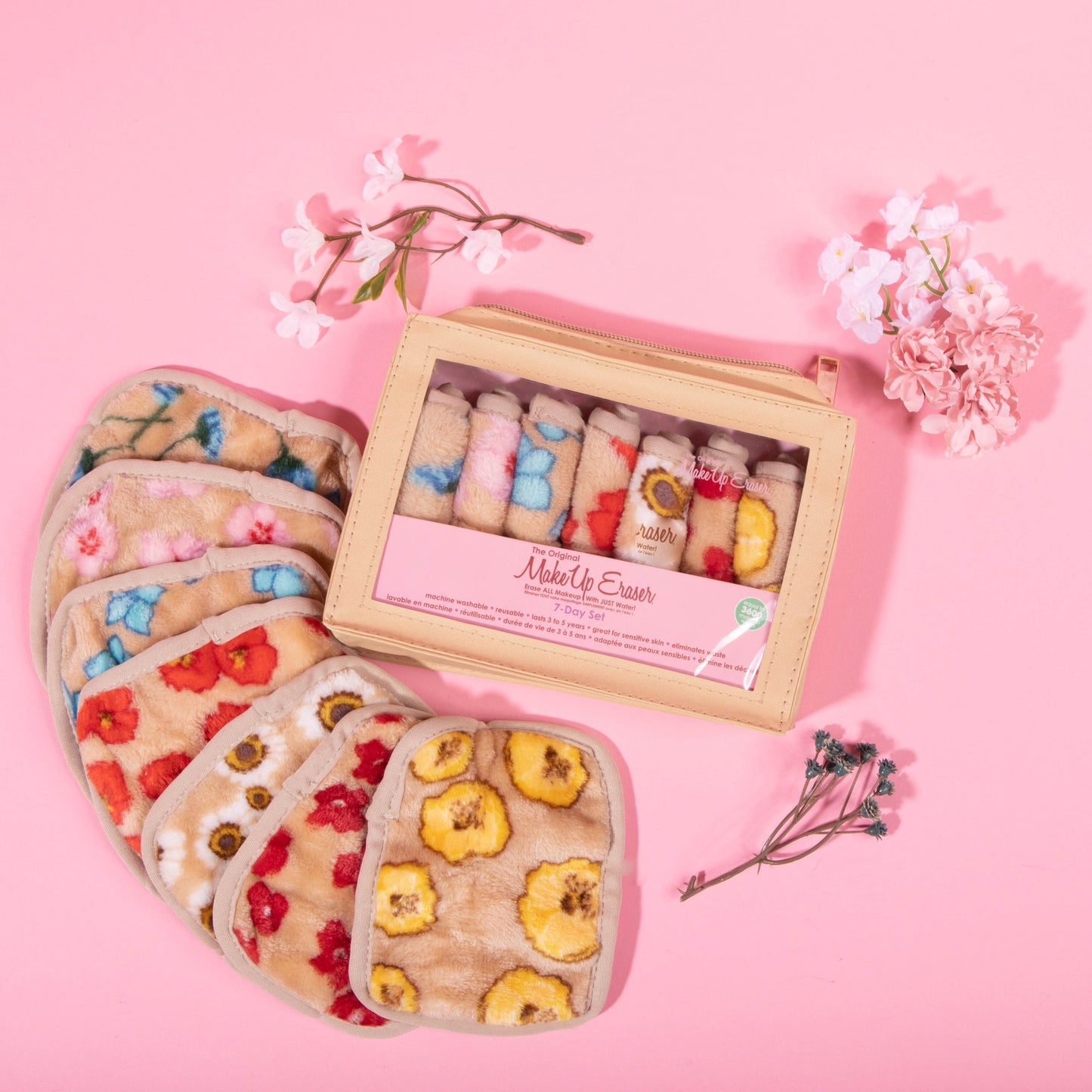 Makeup erasers and box against a pink background